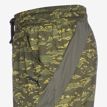 Regular Pantaloni sport 'Concept' de la PUMA pe verde