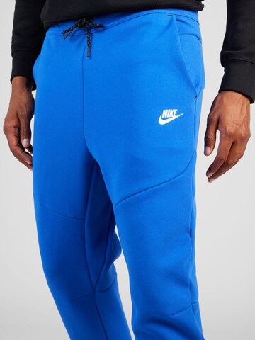 Nike Sportswear Дънки Tapered Leg Панталон в синьо
