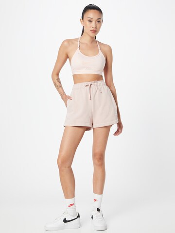 Nike Sportswear Normalny krój Spodnie 'Club Fleece' w kolorze różowy