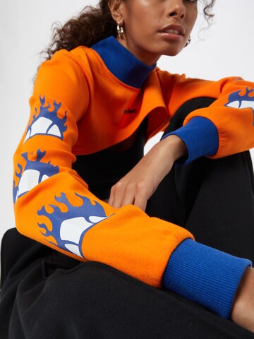 About You x Ellesse Shirt 'Pieta Long Sleeve Funnel Neck Top' in Orange