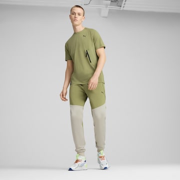 Effilé Pantalon de sport PUMA en vert