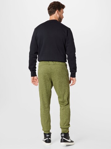 NIKE Tapered Workout Pants in Green