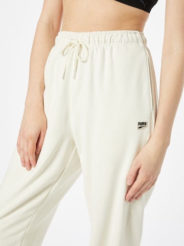 Effilé Pantalon de sport PUMA en beige