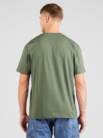 Calvin Klein قميص 'Hero' بلون أخضر
