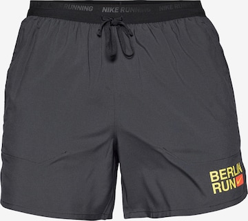 NIKE Loosefit Urheiluhousut 'CITY MRTH STRIDE' värissä musta: etupuoli