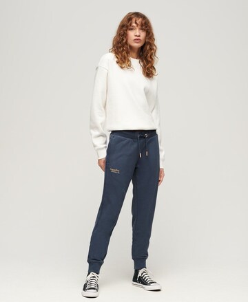 Superdry Tapered Broek 'Essential' in Blauw