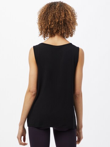 Sport top de la CURARE Yogawear pe negru