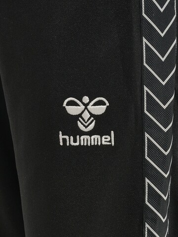 Effilé Pantalon de sport Hummel en noir