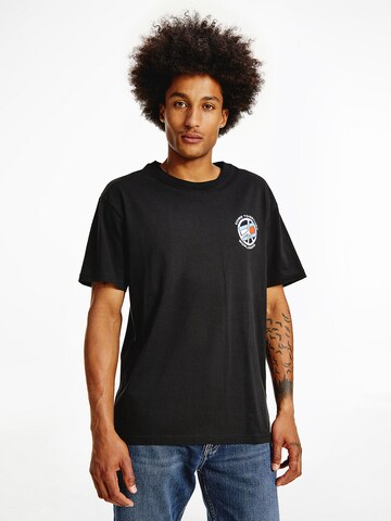 Tommy Jeans Shirt 'Together  World Peace' in Zwart: voorkant