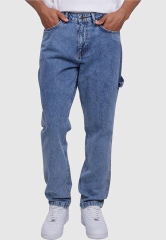 Tapered Jeans de la Karl Kani pe albastru: față