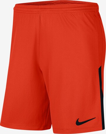 NIKE Workout Pants in Orange: front