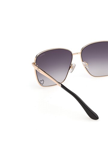 GUESS Sunglasses in Gold