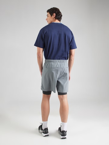 NIKE Regular Sports trousers 'UNLIMITED' in Grey