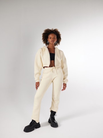HOLLY LOLLY Trousers in Beige: front