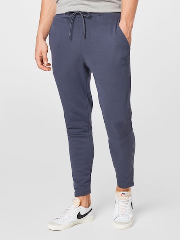 Hummel - Tapered Pantalón deportivo en azul: frente