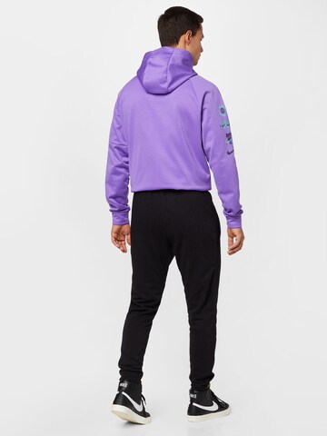 Effilé Pantalon de sport NIKE en noir