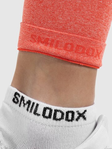 Smilodox Skinny Workout Pants 'Amaze Scrunch' in Orange