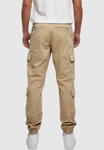 Tapered Pantaloni cargo di Urban Classics in beige