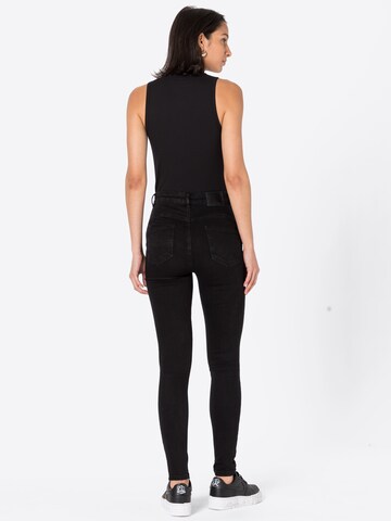 Skinny Jeans '98s' di Warehouse in nero