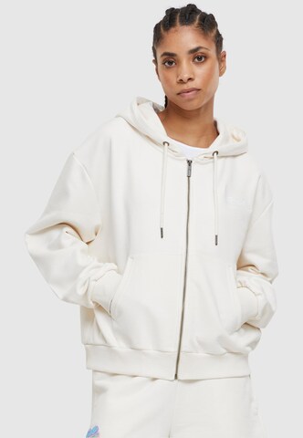 Karl Kani Zip-Up Hoodie in White: front