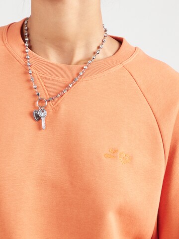 Champion Authentic Athletic Apparel Sweatshirt in Orange