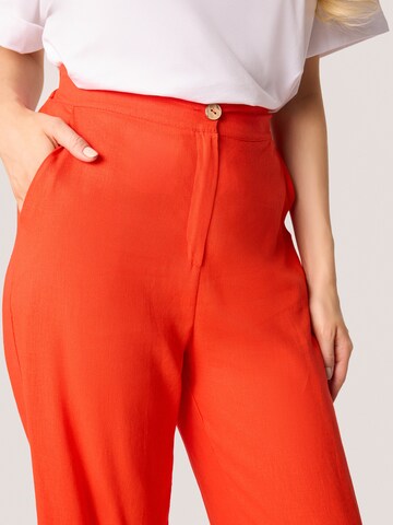 Loosefit Pantaloni di Quiosque in arancione