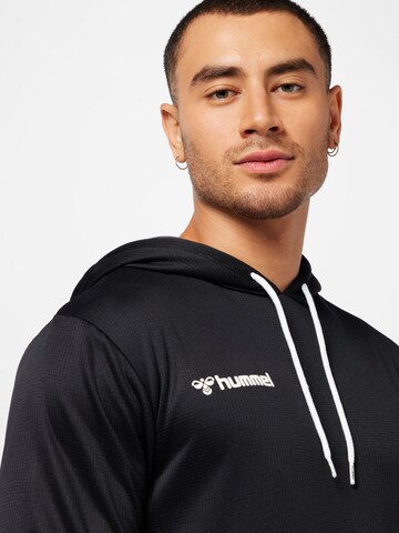 Hummel Sportsweatshirt 'Poly' in Zwart
