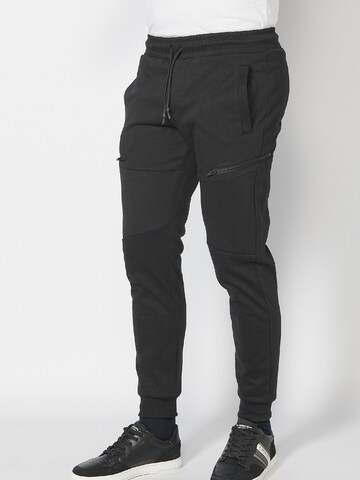 KOROSHI - Tapered Pantalón en negro