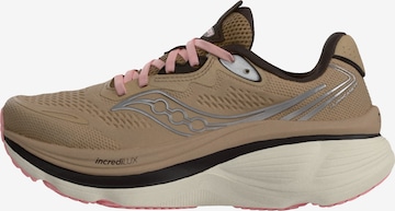 Chaussure de course saucony en marron : devant