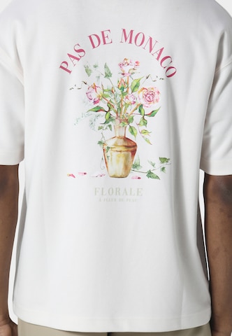 T-Shirt 'Pot De Vie' Pas De Monaco en blanc