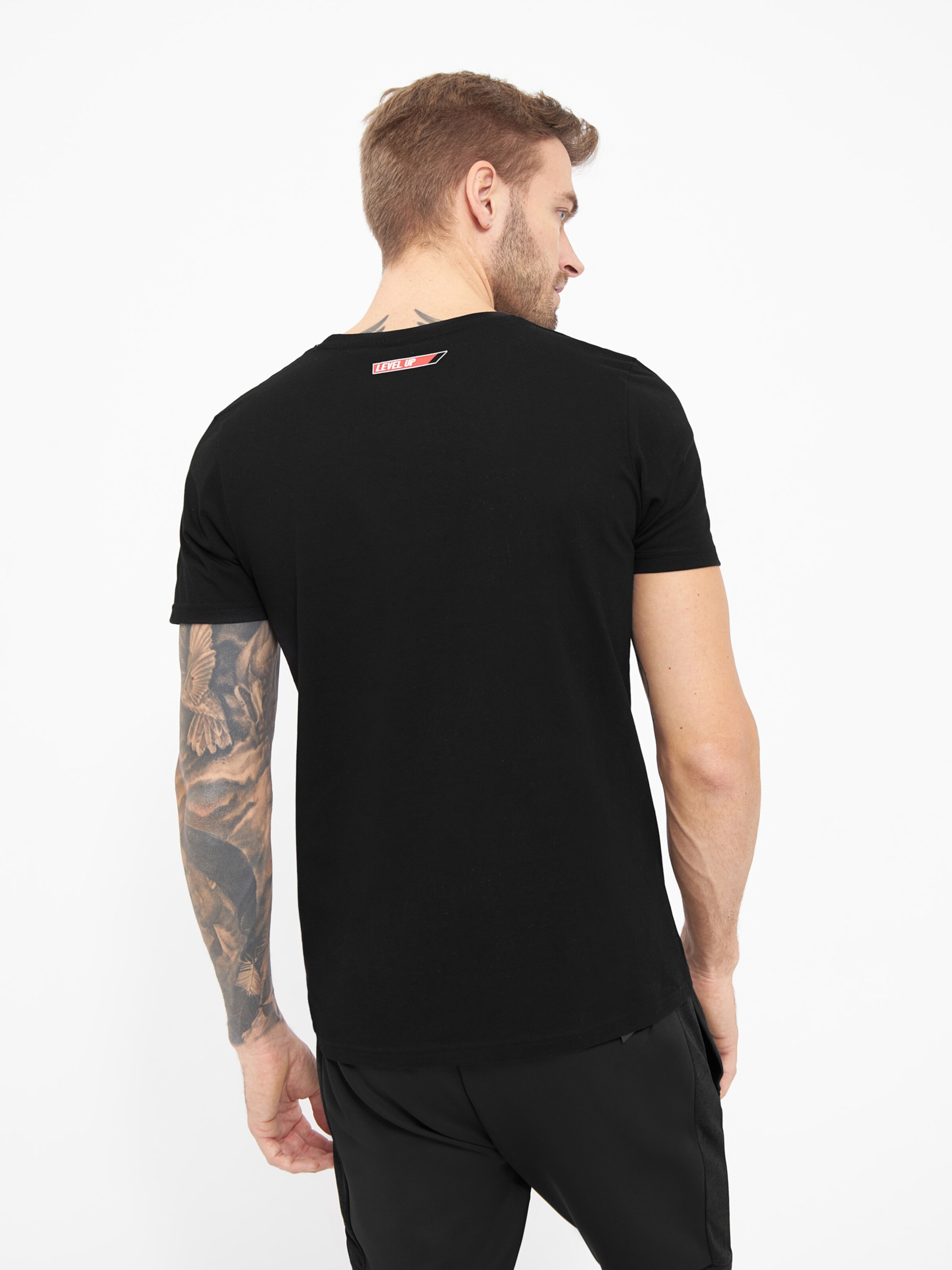 Homme T-Shirt Choke BENCH en Noir 