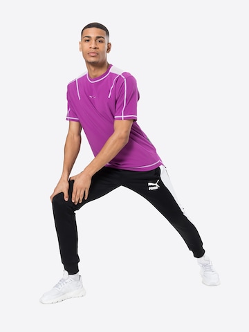 PUMA - Tapered Pantalón en negro