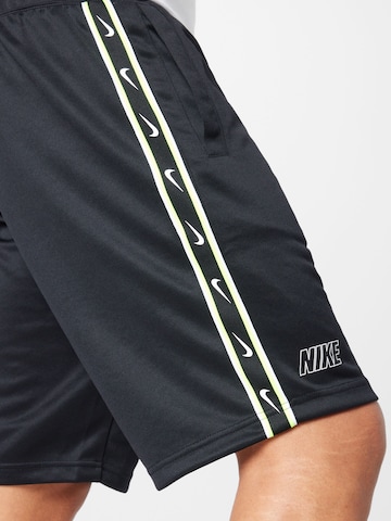 Nike Sportswear Lużny krój Spodnie 'REPEAT' w kolorze czarny