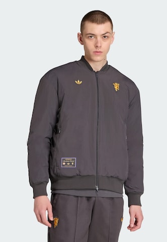 Veste fonctionnelle 'Manchester United Terrace Icons' ADIDAS ORIGINALS en noir : devant