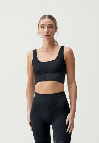 Born Living Yoga Sports Top 'Yami' in Black: front