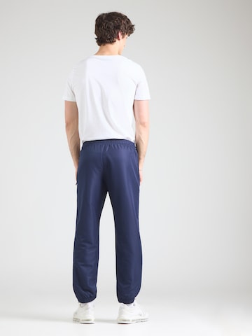 Sergio Tacchini Zwężany krój Spodnie sportowe 'Carson 021' w kolorze niebieski