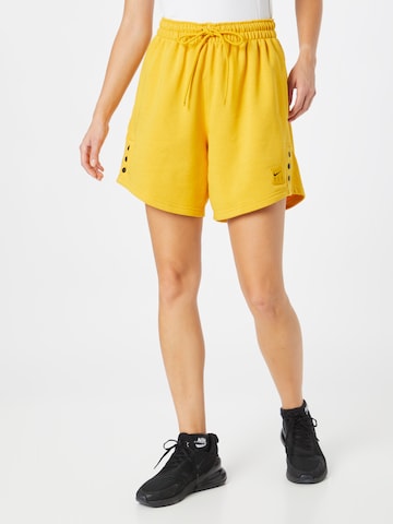 NIKE - Loosefit Calças de desporto em amarelo: frente