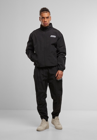 regular Pantaloni di Karl Kani in nero