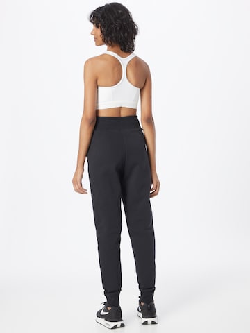 Nike Sportswear Zúžený Kalhoty 'PHOENIX' – černá