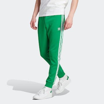 Tapered Pantaloni 'Adicolor Classics Sst' di ADIDAS ORIGINALS in verde: frontale