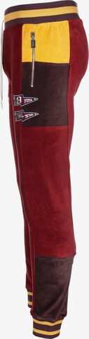 Tapered Pantaloni sportivi 'Tye' di PUMA in rosso