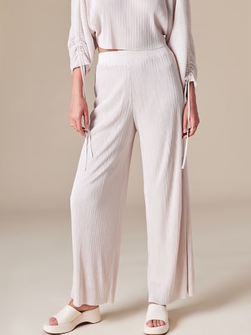 ABOUT YOU x Laura Giurcanu Wide leg Trousers 'Asmin' in Beige: front