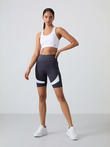 Tommy Life - Tapered Leggings 'Gamaschen' em mistura de cores: frente