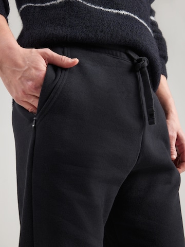 HOLLISTER Bootcut Nohavice - Čierna