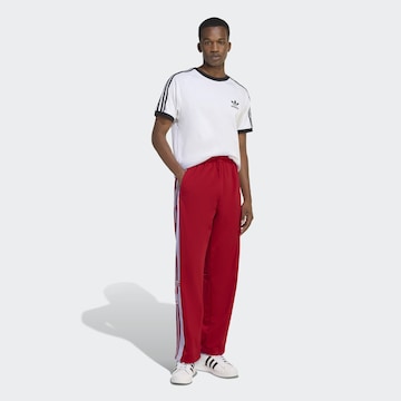 ADIDAS ORIGINALS Loose fit Pants in Red