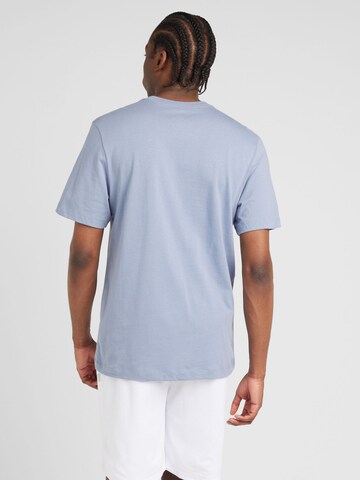 Nike Sportswear - Camisa 'SWOOSH' em azul