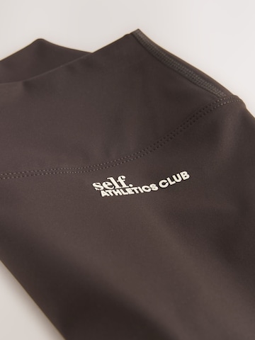 self. Skinny Shorts in Braun