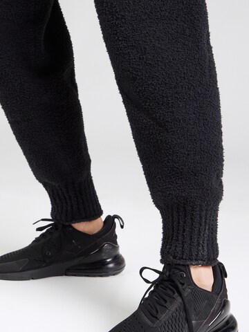 Nike Sportswear Tapered Trousers 'Phoenix' in Black
