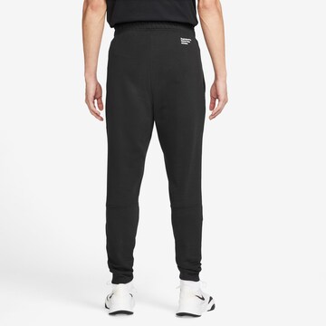 NIKE Tapered Funktionshose in Schwarz