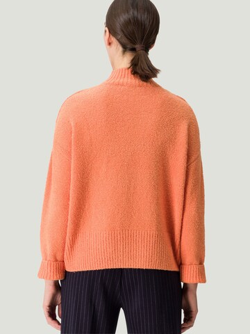 Pullover di zero in arancione